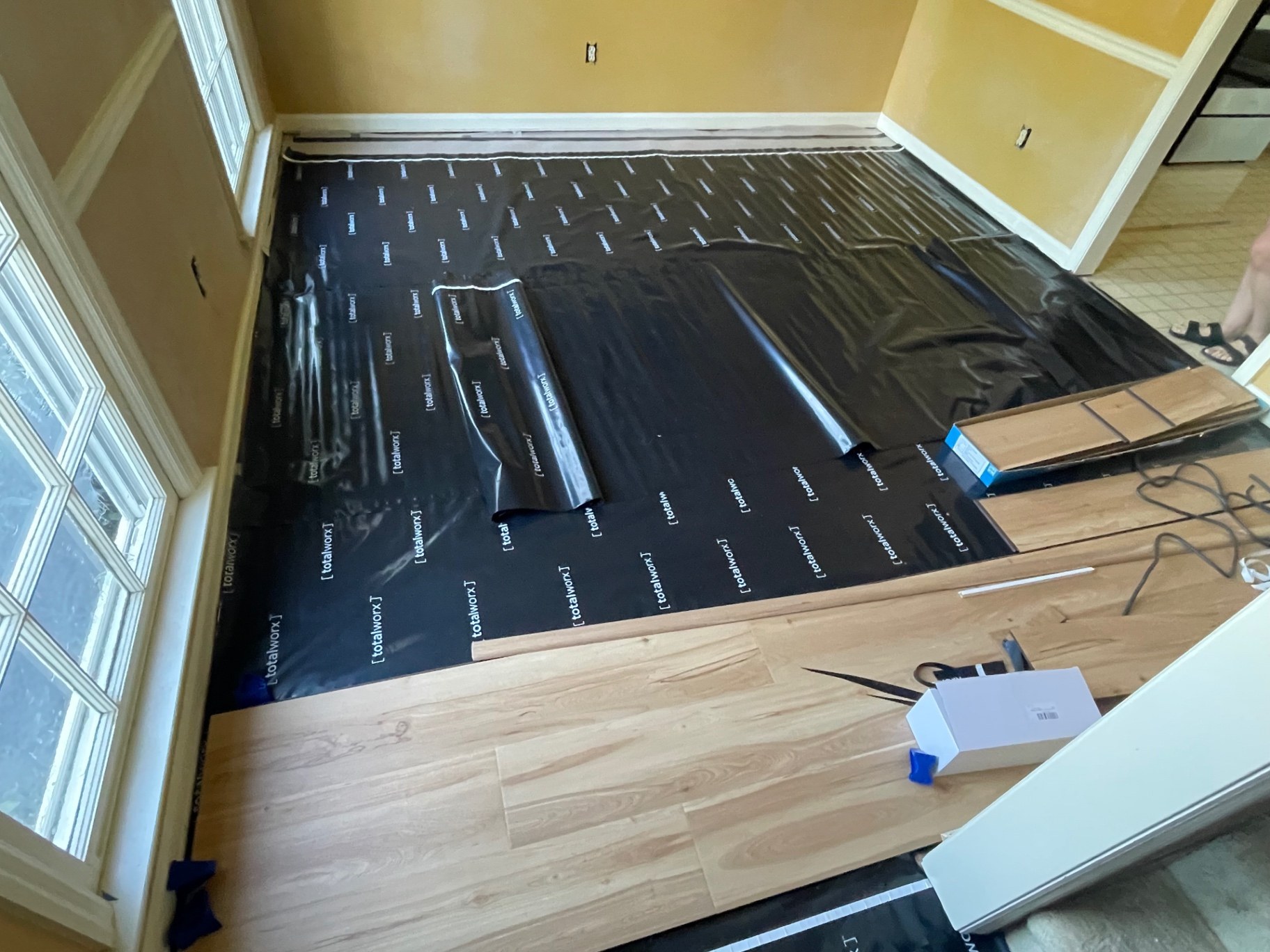 Vapor barrier and underlayment installed before luxury vinyl plank in a Buford GA home