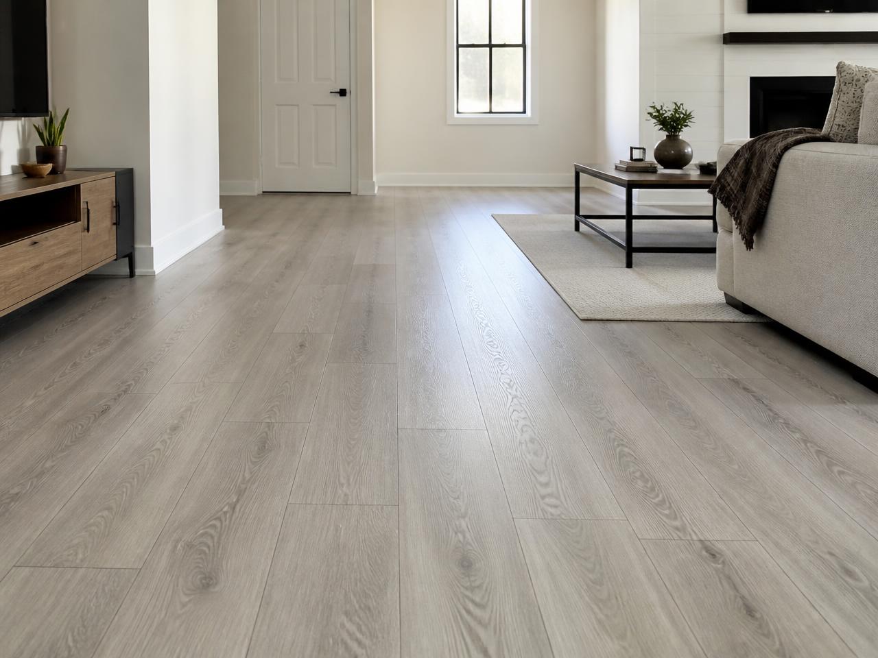 Light oak laminate plank flooring being installed in a North Georgia home